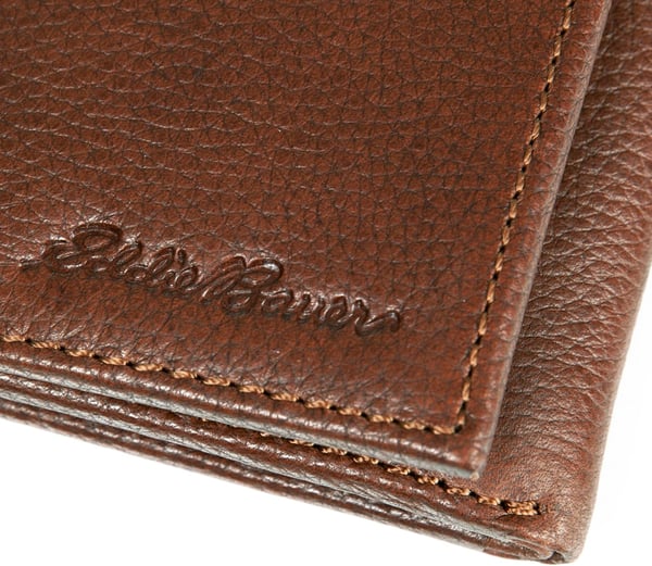 Eddie Bauer Mens Signature Logo Leather Trifold Wallet with 6 Card Slots and RFID ProtectionTan