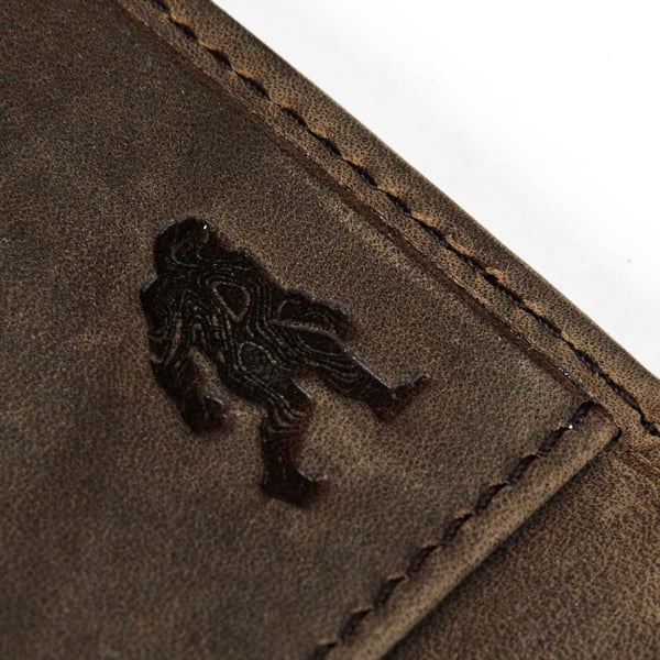 Eddie Bauer Embossed Sasquatch Leather Money Clip Bifold Wallet with RFID Protection  TanEddie Bauer Embossed Sasquatch Leather Money Clip Bifold Wallet with RFID Protection  Tan