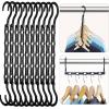 imageHOUSE DAY Closet Organizers and Storage 12 Pack College Dorm Room Essentials Multifunctional Organizer Magic Space Saving Hangers with 5 Holes Storage Organization for Wardrobe ClosetBlack